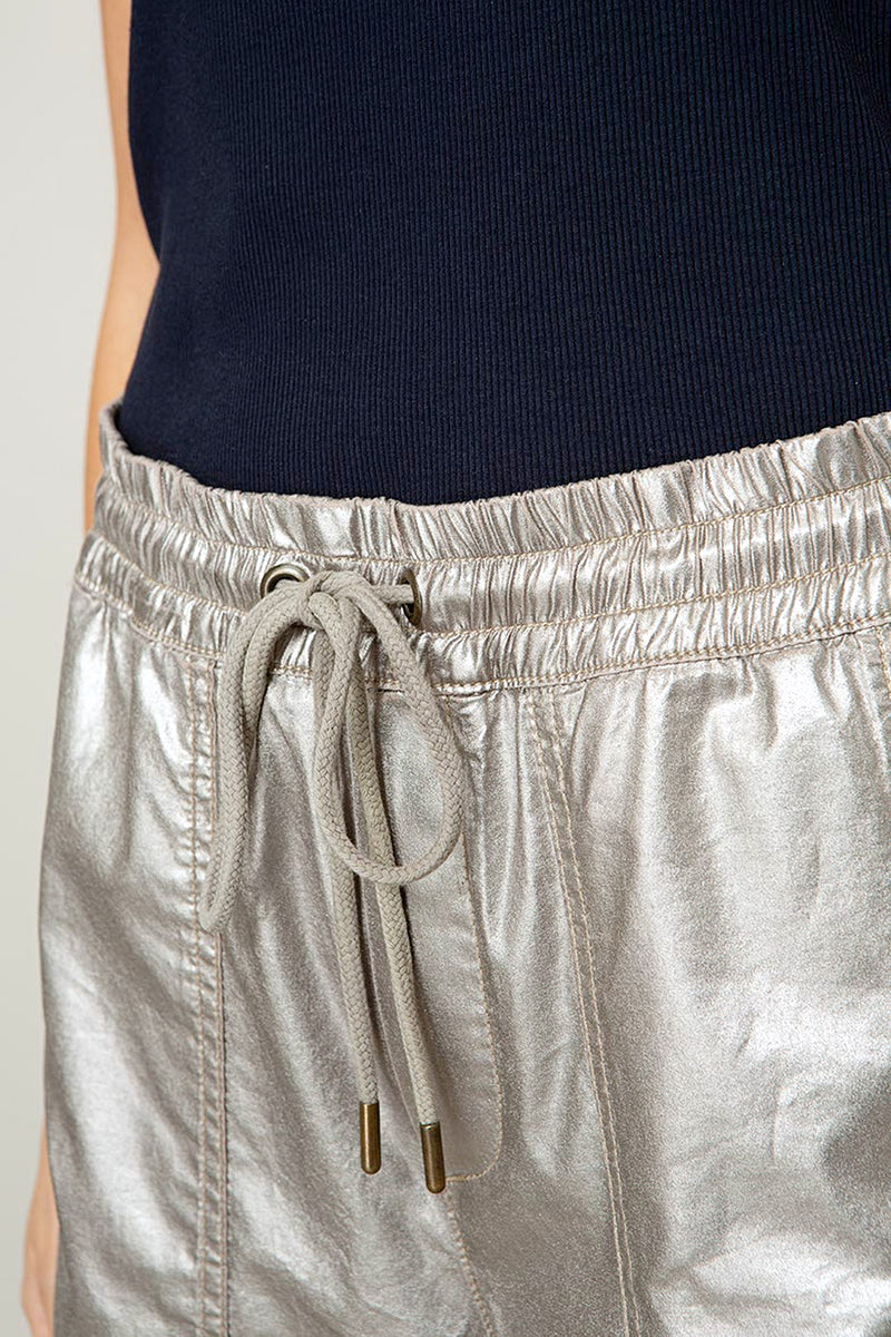 Trousers with a metallic look