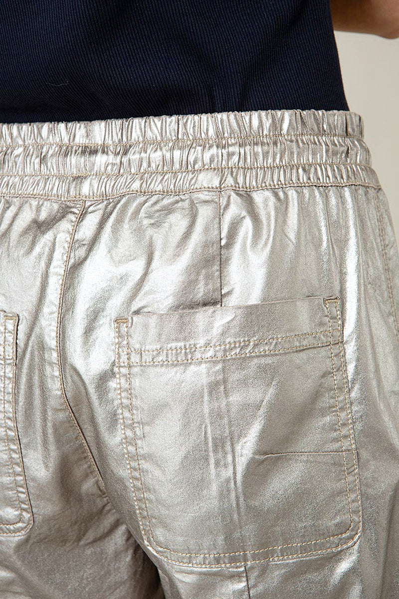 Trousers with a metallic look