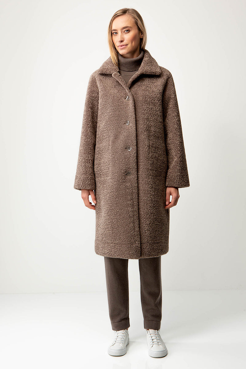 Coat in faux fur