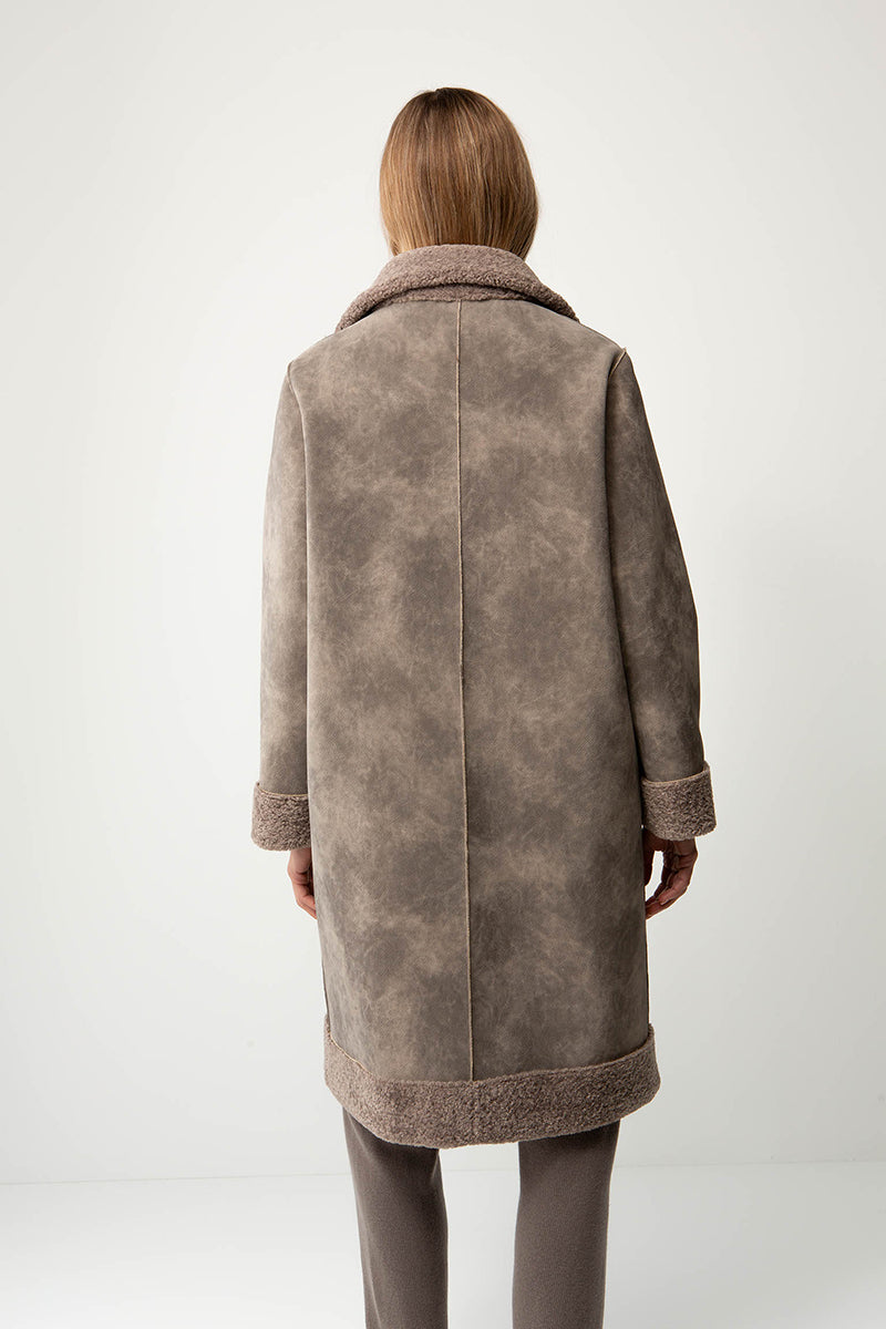 Coat in faux fur