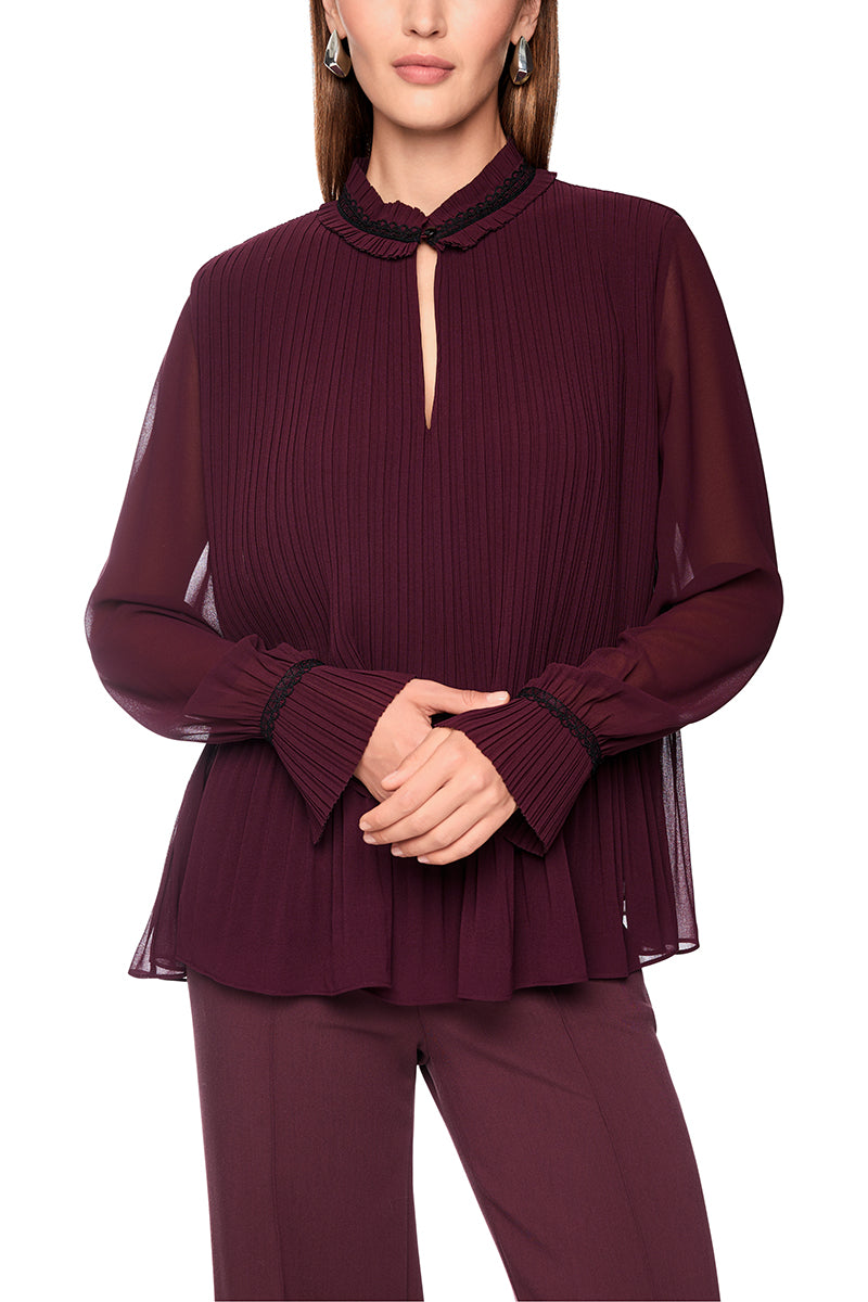 Pleated blouse with feminine details