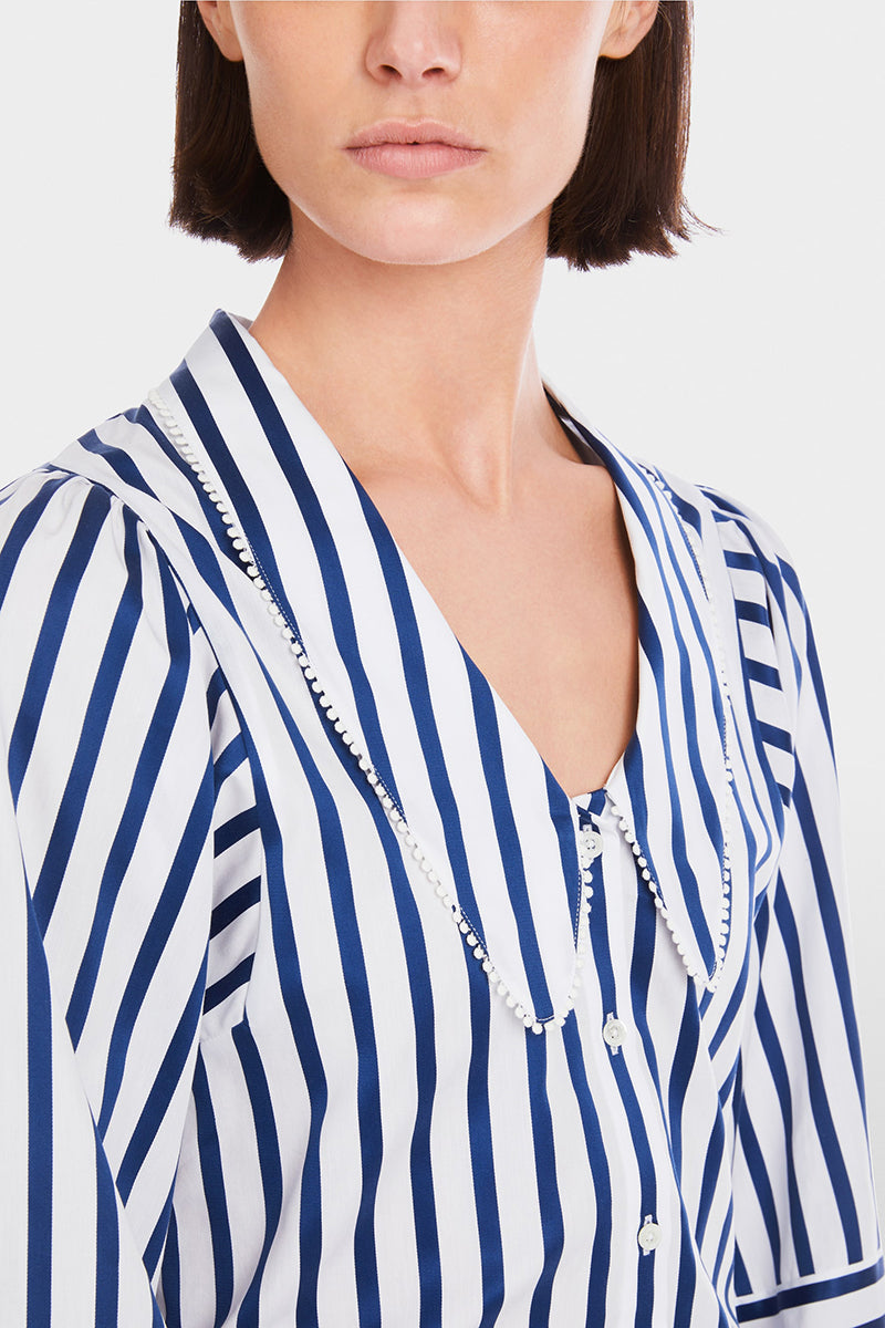 Blouse with tasselled trim