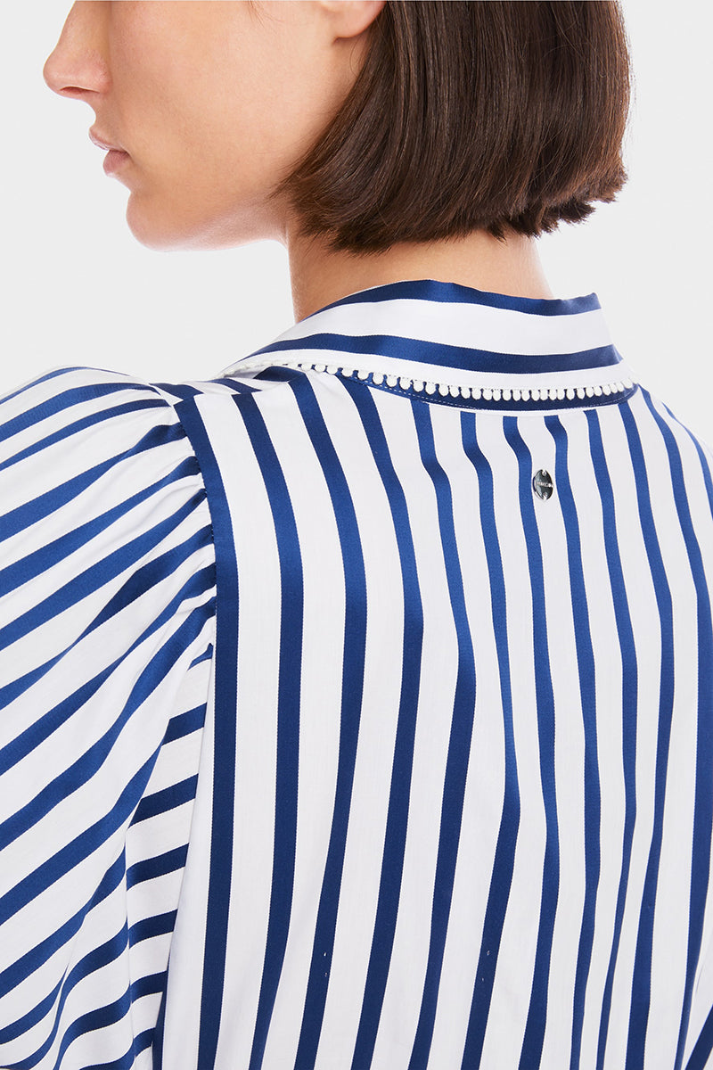 Blouse with tasselled trim