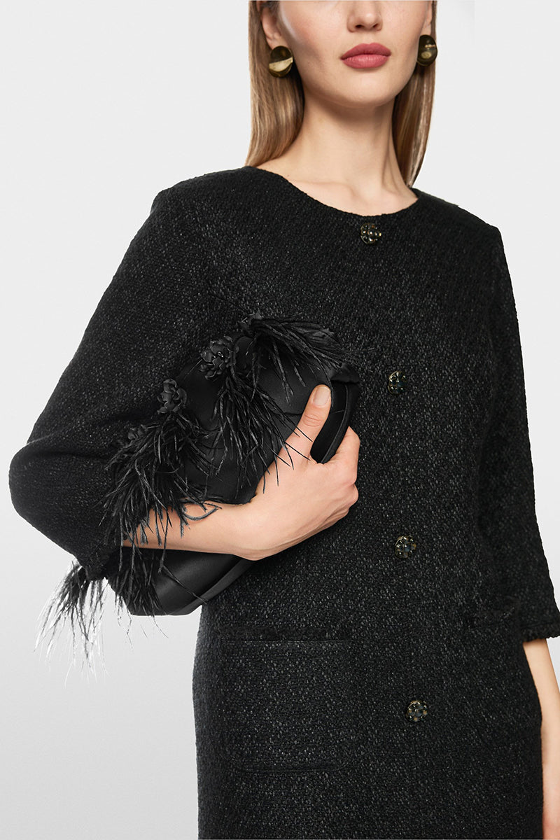 Elegant clutch bag with feathers