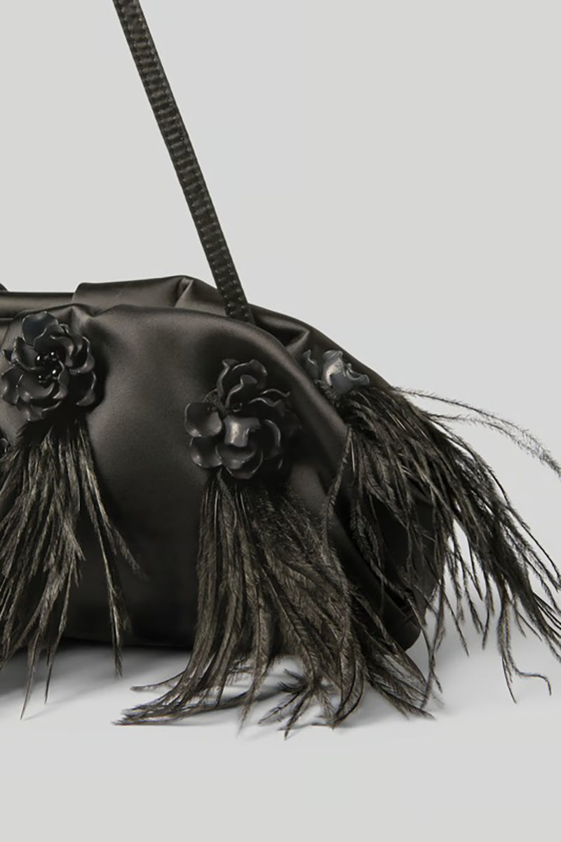 Elegant clutch bag with feathers