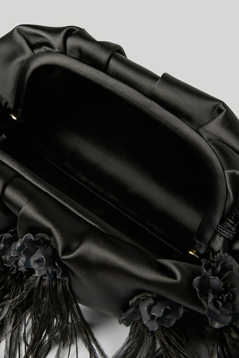 Elegant clutch bag with feathers